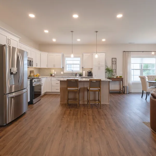Open-concept kitchen, dining and living area in a Rabbit Ridge senior living home in Syracuse, Indiana.