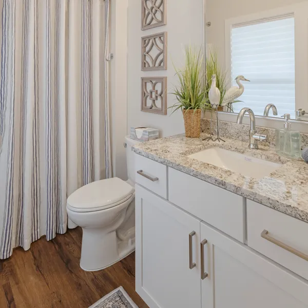 Guest bathroom with granite vanity in a Rabbit Ridge senior living residence in Syracuse, Indiana.